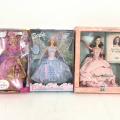 A collection of three Boxed Barbie dolls including Three Musketeers..Swan Lake. And Grand Entrance. (3)