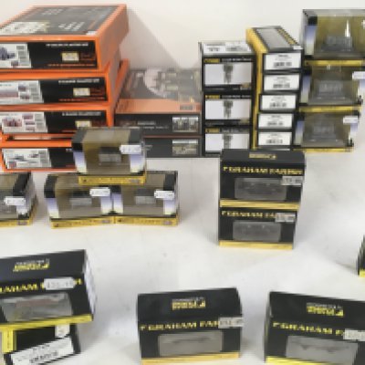 A collection of 33 new boxed N gauge railway models featuring both buildings..carriages and wagons. Manufacturers include Graham Farish and Gaugemaster.