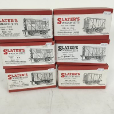 A collection of 6 new and boxed model railway wagon kits by Slaters. 0 gauge