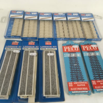 A collection of of boxed Peco model railway pieces from the Lineside kits. 00 gauge.