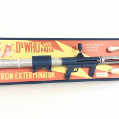 A very rare Dr Who Anti-Dalek Neuron Exterminator. This is an original weapon mounted on a reproduction board with reproduction shells.