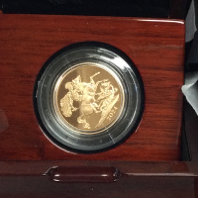 A 2024 gold proof sovereign. Postage B