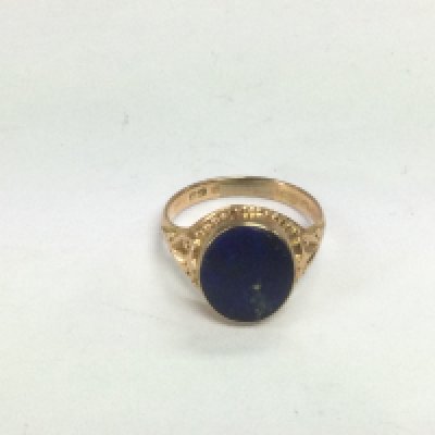 A 15ct gold signet ring set with Lapis Lazuli, approx 5.6g and approx size V. Shipping category A.