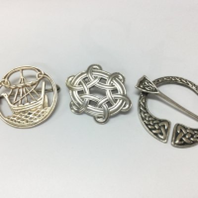 Three sterling silver Celtic brooches . Postage category A NO RESERVE