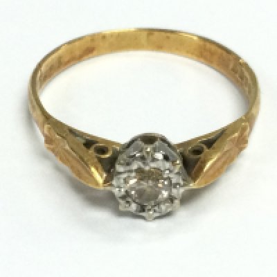 An 18ct gold solitaire diamond ring. Size N and approximately 2.10g Postage A