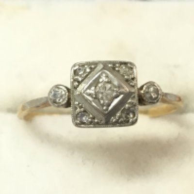An unmarked 18ct gold and diamond set ring, size N/M. 1.7g total weight. Postage catA