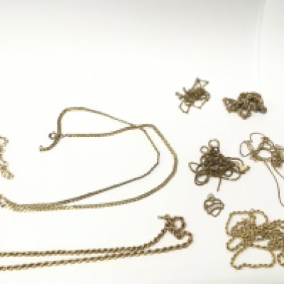 A collection of 9ct gold chains and two pendants. 32g total weight. Postage category A