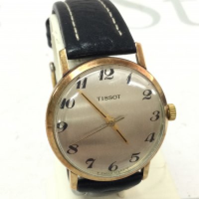 A Tissot 9ct gold vintage gents wristwatch with convex glass and leather strap (working)