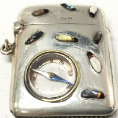 A silver vesta case set with shibyama bugs and compass. postage category A