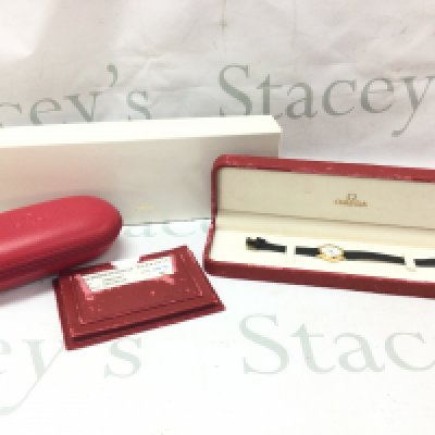 A ladies omega Deville wrist watch boxed (18ct cased) with papers and service box . Seen working.postage category b