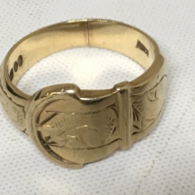 A 9 ct gold buckle ring 6.5 grams.