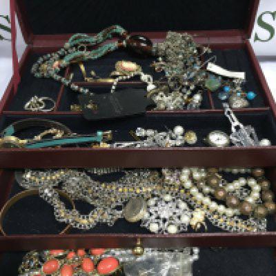 A box of mixed costume jewellery.