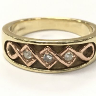 A 9ct gold ring set with diamond stones , size O , 4.9g total weight. postage category A