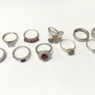 A collection of silver dress rings , mostly size P. Postage catA