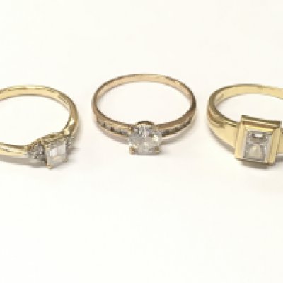 9 carat cubic zirconia set gold rings and one 14ct ring , 7g total weight. Sizes O,P and Q. Postage category A