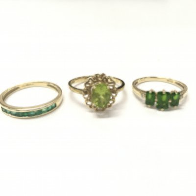 9 carat gold rings including an emerald half band , peridot ring, Diopside ring. 5.8g total weight. Sizes Q and O. Postage catA