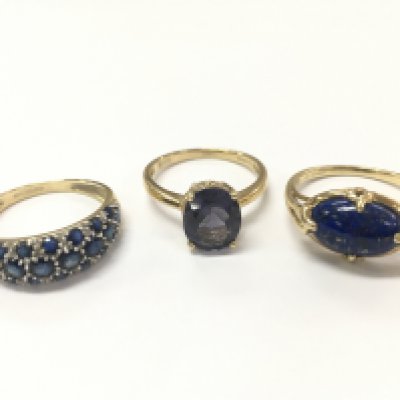 9ct gold rings including a blue sapphire half band ring size Q 2.6g , purple stone cocktail ring size O 2.5g , lapis ring 2.9g size Q. Postage category A