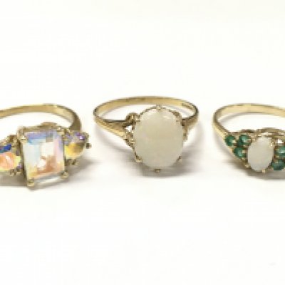 9ct gold rings , including a mystic set stone ring (size N), Opal stone set ring (size Q), Opal and green stone (size R) .6.1g total weight. Postage category A