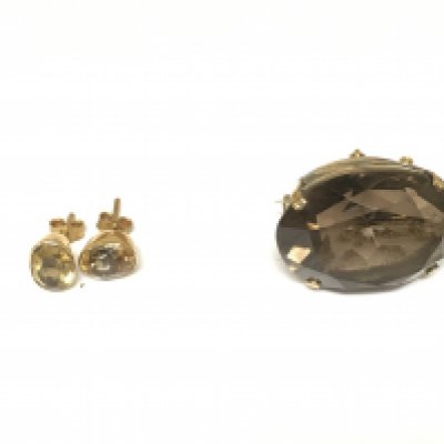 A pair of citrine earrings and a large quartz brooch.