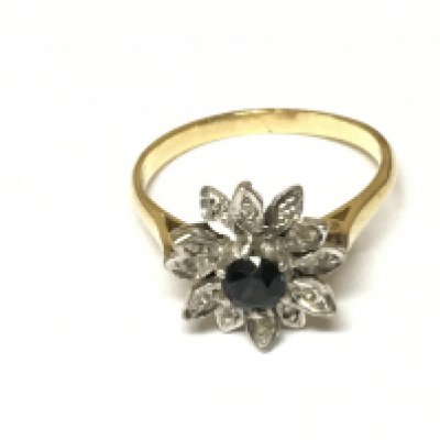An 18ct gold Florian ring set with sapphire. Size T and 5.06g