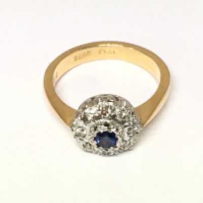 A 22ct gold ring set with sapphire and diamonds. Approx Size N and 6g