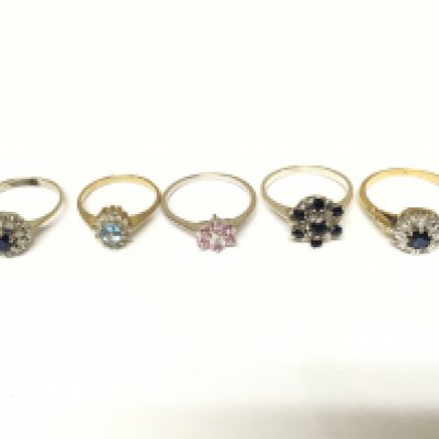 Five unmarked cluster rings set with various gems. Approximately 11.3g and sizes I L N O1/2