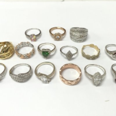 A Collection of silver and non silver rings set with CZ and other various gem stones. Sizes P and O etc . Postage category A