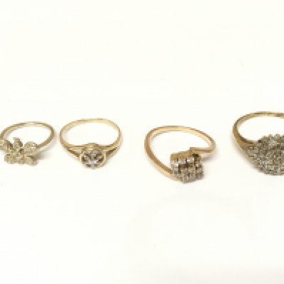 Four unmarked cluster rings set with diamonds. Approximately 8.2g and sizes C 1/2 K M and S