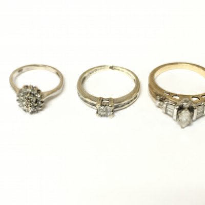 Three 9ct gold diamond cluster rings two are white gold. Approximately 8.3g and sizes F J and M 1/2