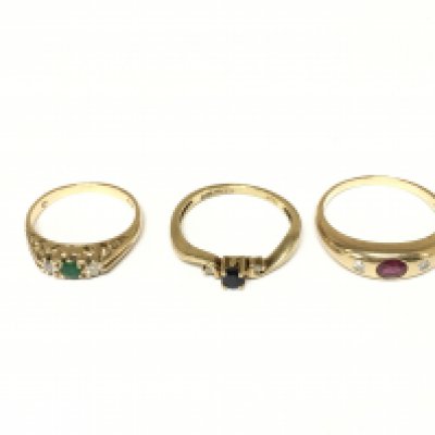 Three 9ct gold rings set with mixed gem stones. Approximately 7g and sizes L O and R
