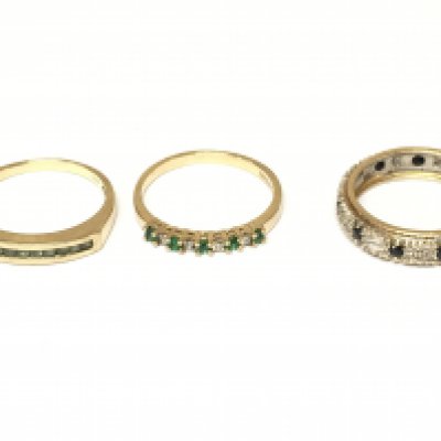 Three 9ct gold rings set with various stones including a full eternity ring. Approximately 6.4g sizes M and N