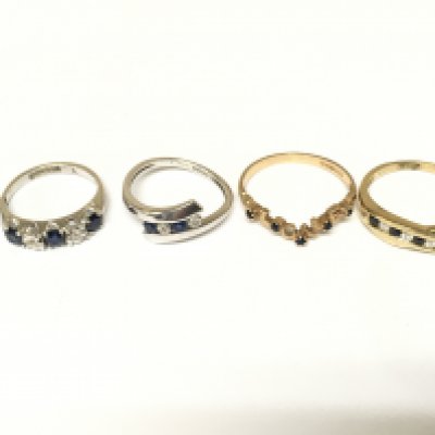4 rings set with diamonds and sapphires three marked 9ct gold. Total weight approximately 7.1g. Sizes I K O P