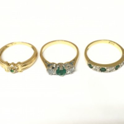 Three 18ct gold diamond and emerald set rings. Approximately 7.3g and sizes J and K