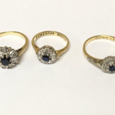 Three 18ct gold diamond and sapphire cluster rings. Approximately 10g sizes H and N