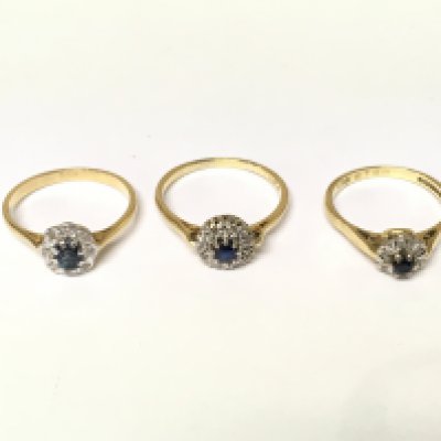 Three 18ct gold diamond and sapphire cluster rings. Approximately 8.4g sizes M O P