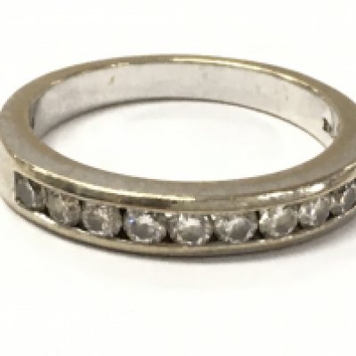 A 9 stone 18ct gold half eternity ring. 4.8g total weight. Size N. Postage category A