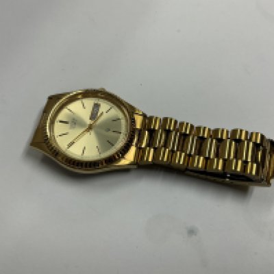 a gents gold coloured citizen dress watch.