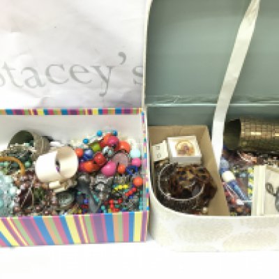 Two boxes of costume jewellery including bracelets, pendants , brooches etc . Postage category C