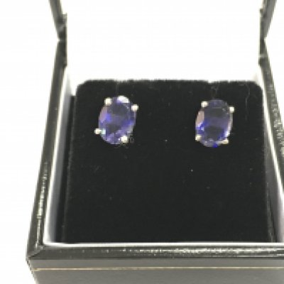 A pair of Iolite studs in silver with box. Postage B