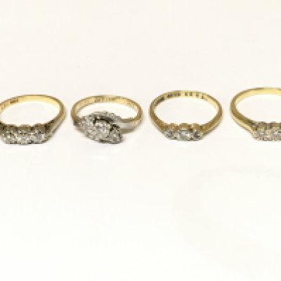 Four 18ct gold 3 stone diamond rings. Approximately 10.2g and sizes K M and O