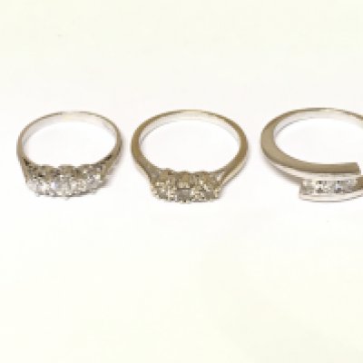Three 18ct white gold 3 stone diamond rings. Approximately 8.2g and sizes I L and O1/2