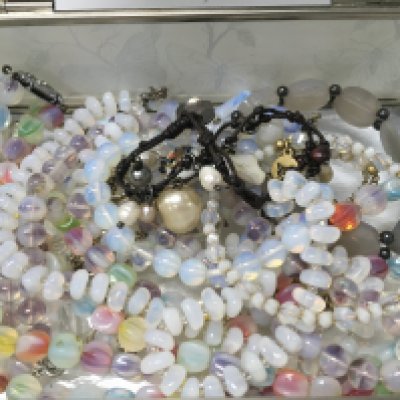 A glass butterfly box with vasilene glass necklaces