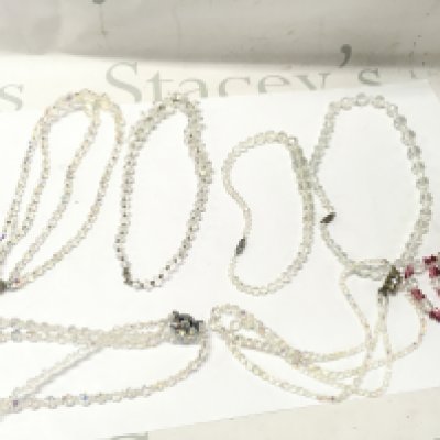 A Collection of crystal necklaces , 3 double rows 4 single rows. Postage catA