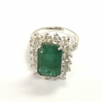 18ct white gold Zambian emerald and diamond cluster ring. Step cut emerald heavily flawed. With gemologists report. Size N