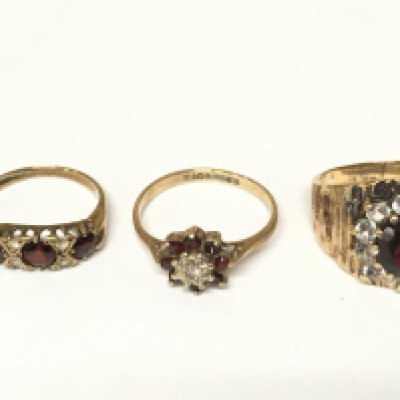 Three 9ct gold rings set with assorted gems. Approximately 8.53g and sizes I M and M 1/2