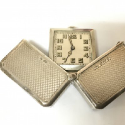 A hallmarked silver travel watch. 46g Postage A