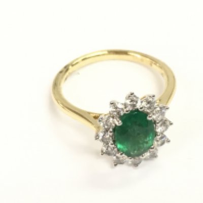 18ct white and yellow gold oval emerald no diamond cluster ring. Emerald 1.16ct and 0.60ct diamonds. Size M 1/2