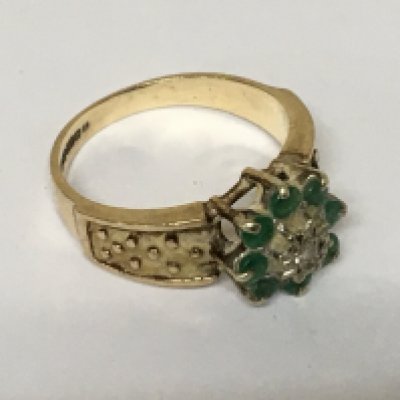 A9carat gold ring set with a pattern of emerald and small diamonds. Weight 4g