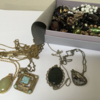 A Collection of costume jewellery including polished stone set pendants. 