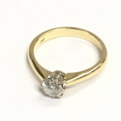 An 18ct gold diamond solitaire ring. Diamond 0.65ct approximately. Size Q 1/2